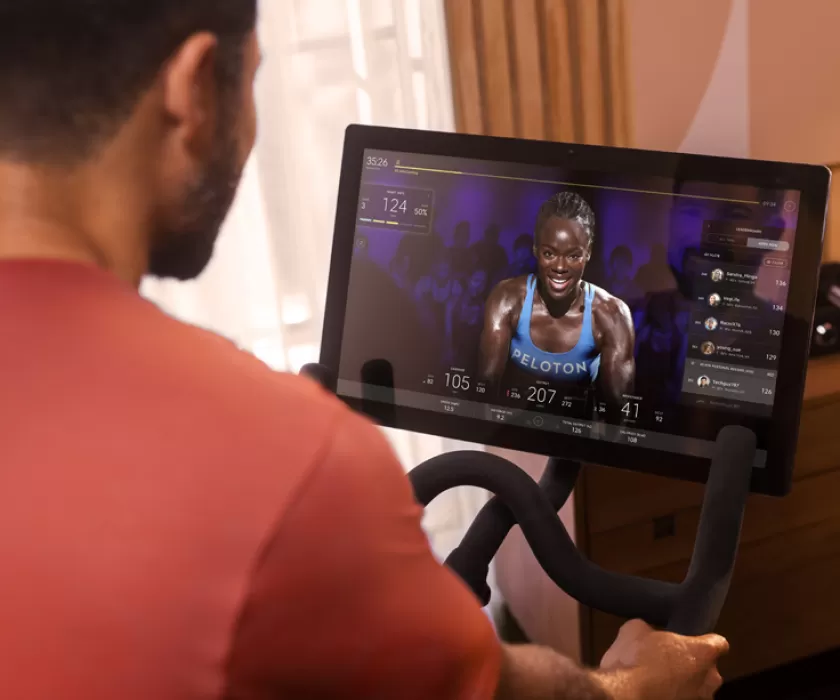 Man using a Peloton bike at the Y