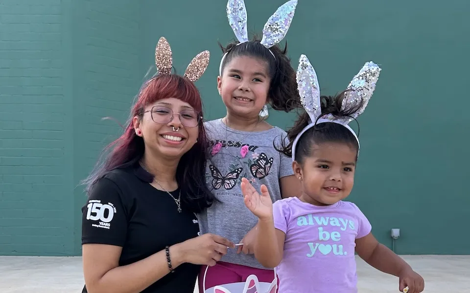 Members wearing bunny ears and attending a Y Easter Event